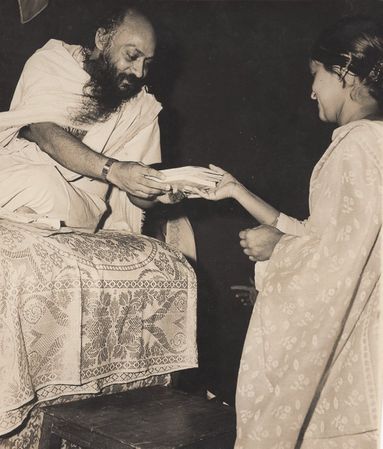 receiving books from Osho